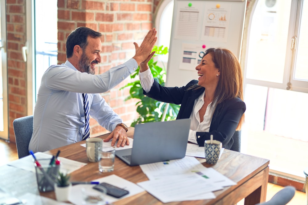 Financial advisors celebrating a closed deal